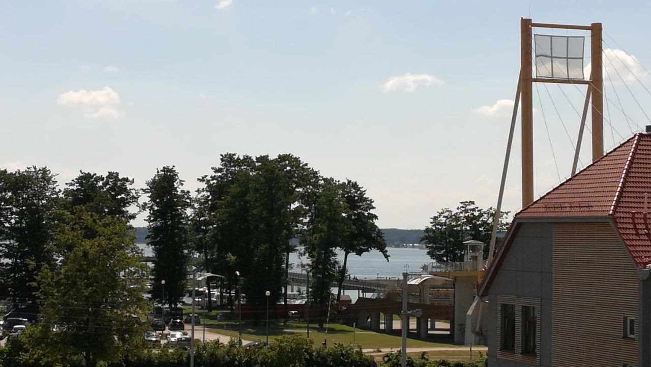 Апартаменты Luksusowy apartament z widokiem na jezioro Гижицко